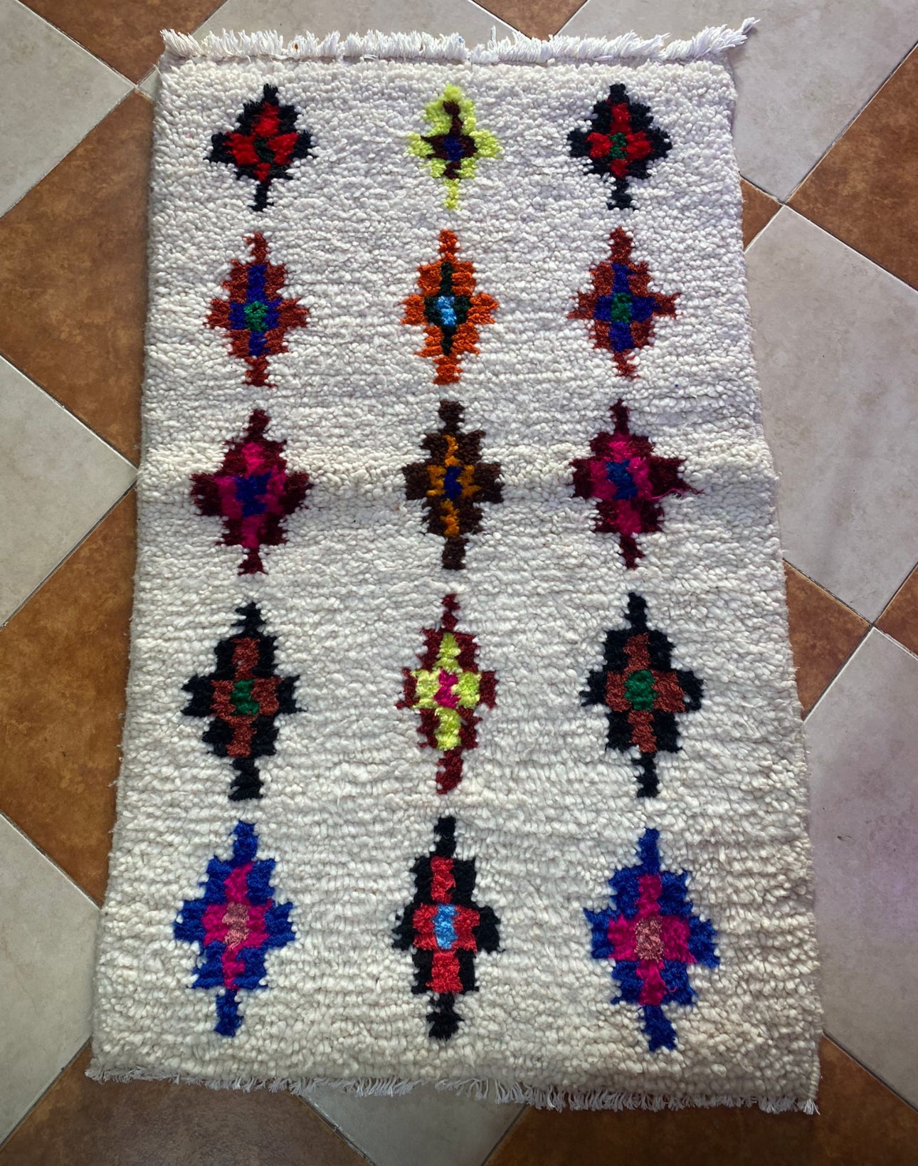 The rug is small, measuring 100x60cm, or a bed cover.